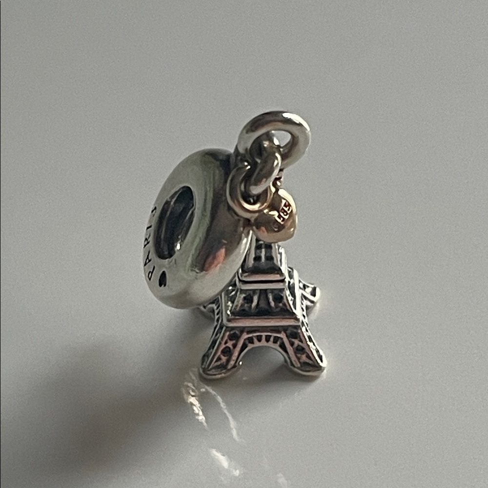 Pandora Silver and mini Gold heart Eiffel Tower Charm.